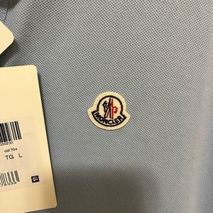 Brand new Moncler polo . Size large.